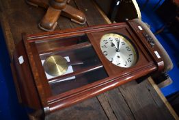A 1920s wall clock having silvered dial