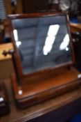 A Victorian mahogany toilet mirror with drawer base