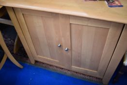 A modern beech effect laminate side cabinet