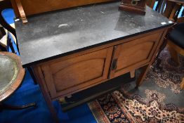 An Edwardian oak wash stand