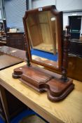 A Victoriann mahogany toilet mirror on trinket base