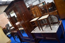 An Edwardian mahogany bedroom suite comprising mirror door wardrobe, dressing table, wash stand