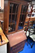 An Edwardian mahogany bureau bookcase of small proportions