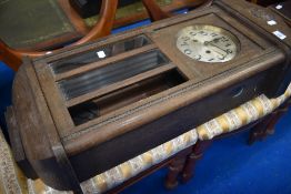An early 20th Century oak cased wall clock