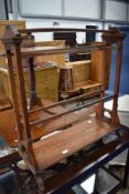 A Victorian stained frame aesthetic style towel rail