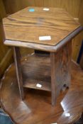 An Arts and Crafts style oak plant stand