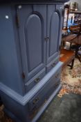 A modern painted tallboy style cabinet