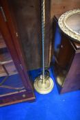 A traditional brass standard lamp