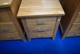A modern beech bedside chest
