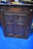 A period oak corner cupboard of large proportions