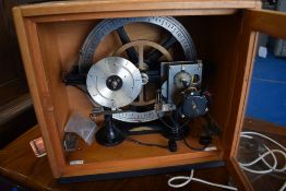 A vintage cased electric timing calendar clock , possibly a regulator having smiths self starting