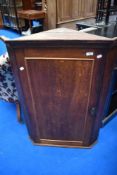 A 19th Century oak corner cupboard