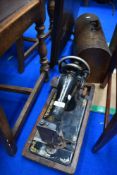 A vintage singer sewing machine in dome top wood case