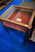A late 19th or early 2th Century oak bijouterie table