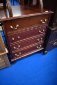 A modern mahogany four drawer chest