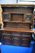 A vintage oak priory style dresser