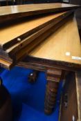 A 19th Century extending dining table with several leaves and centre leg support