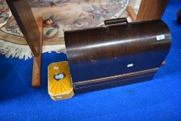 A cased sewing machine and accesories