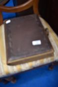 A Victorian photo album, with some photos