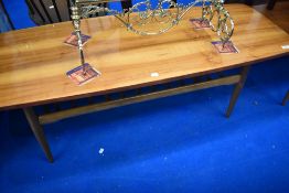 A vintage coffee table having polished top and slatted undertier, approx 137 x 50cm