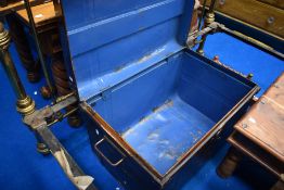 A vintage tin trunk, with broken catch