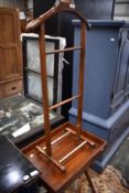 A hardwood butlers style tray on stand and valet