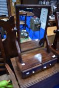A Victorian mahogany toilet mirror with drawer base