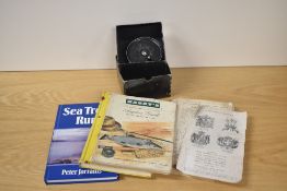 A small group of fishing books including Hardy Anglers guide and A J W Young 3.5 inch Condex fly