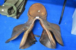 A vintage leather saddle, studs marked Gibson Saddlers, New Market