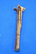 A selection of six wooden walking sticks with wooden handles Average length is 90cm