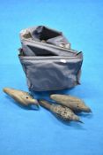 A canvas bag containing a good quantity of crow decoys