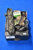 A box of shooting accessories including ear defenders cartridge belt and digital camera binoculars