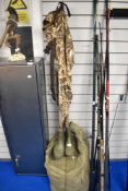 A pair of prologic max 4 waders size large boot size 9. A pro climate camoflage suit of jacket and