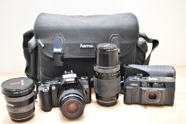 A Canon EOS500 camera with Canon Ef35-80mm 1:4,5-5,6 lens, a Ricoh TF900 Automatic camera, a Vivitar