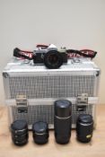 A Pentax MX camera with SMC Pentax-M 1:1,7 50mm lens, a SMC Pentax 1:4 200mm lens, a SMC Pentax 1:
