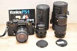 A Konica T3 camera No870614 with Hexanon AR 1:3,5-4,5 35-70mm lens, a Hexanon AR 1:3,2 135mm lens