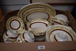 A collection of Midwinter tableware having white ground with cream and burgundy bands with gilt