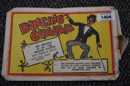 An original Dancing Charlie Illusion Doll, in original paper envelope with instructions present