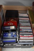 Three vintage tins, a Polaroid Supercolour instamatic camera and a selection of compact discs of