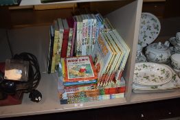 A selection of Rupert Bear annuals and books.