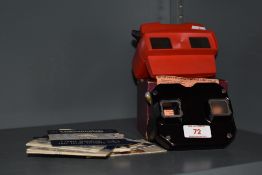 Two vintage Viewmaster Stereoscopes and a selection of slides.