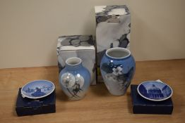 Two Royal Copenhagen bud vases, with butterfly and dandelion designs, the largest 12cm, and two