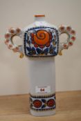 A mid-20th Century Korosten porcelain decanter, no stopper, hand painted with a floral design,