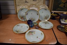 Six continental enamelled cabinet plates, having duck egg blue ground, decorated with insects and