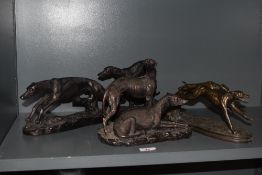 Three bronze effect greyhound studies, the largest measuring 45cm long