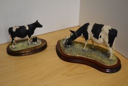 A Border Fine Arts farm animal/cattle group 'Holstein Fresian Cow & Calf' B0309, designed by