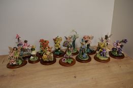 A group of thirteen 'Flower Fairies' figurines, produced by Enesco EEGG Limited and inspired by