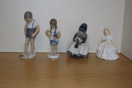 A Royal Copenhagen (Denmark) porcelain figurine 'Armager Girl Sewing' number 1314, with printed