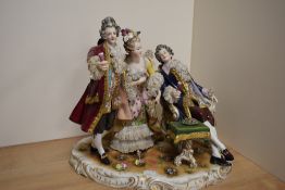An early 20th century Rudolstadt-Volkstedt porcelain figural tableau group, formed as a group of