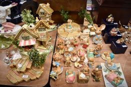 A collection of hand-painted stonecraft 'Pendelfin' rabbit figures and display stands, various to